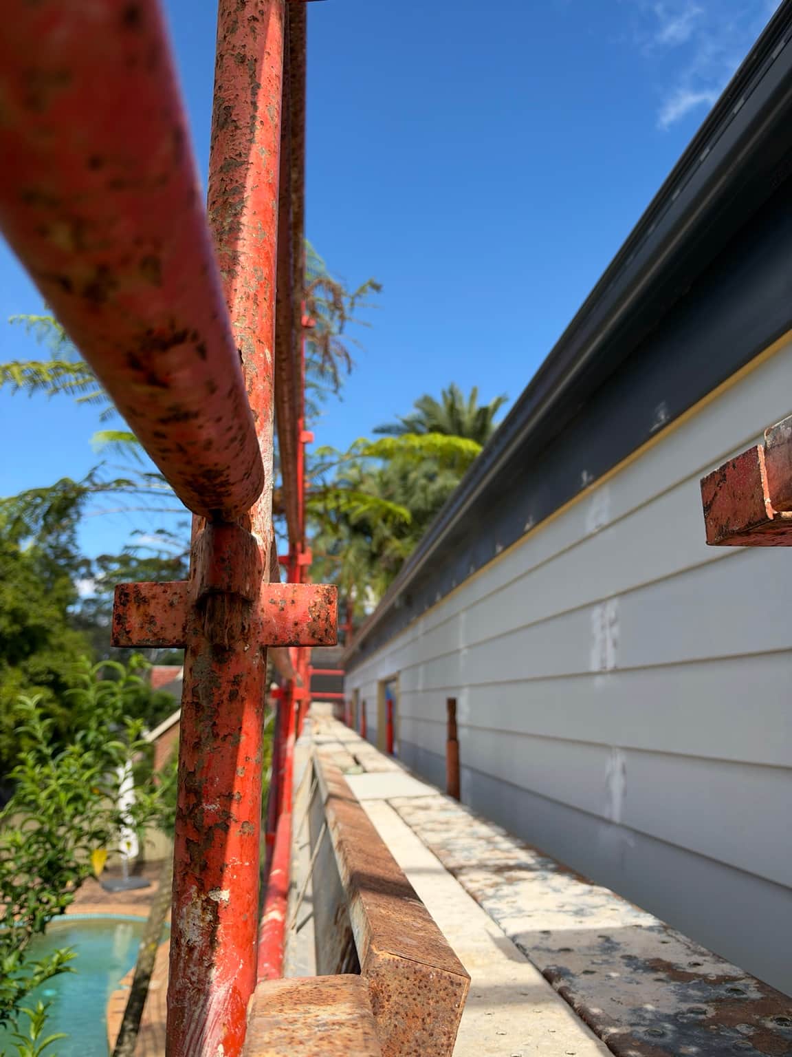 Exterior eaves and grey fascia detail during painting work in Beecroft