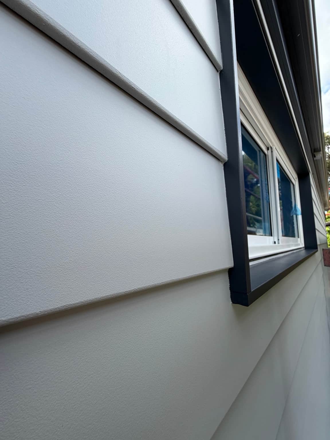 Grey window trim and light painted weatherboards in Beecroft