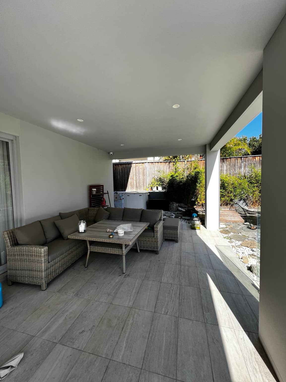 Painted walls and ceiling in the covered alfresco seating area at a Bella Vista home