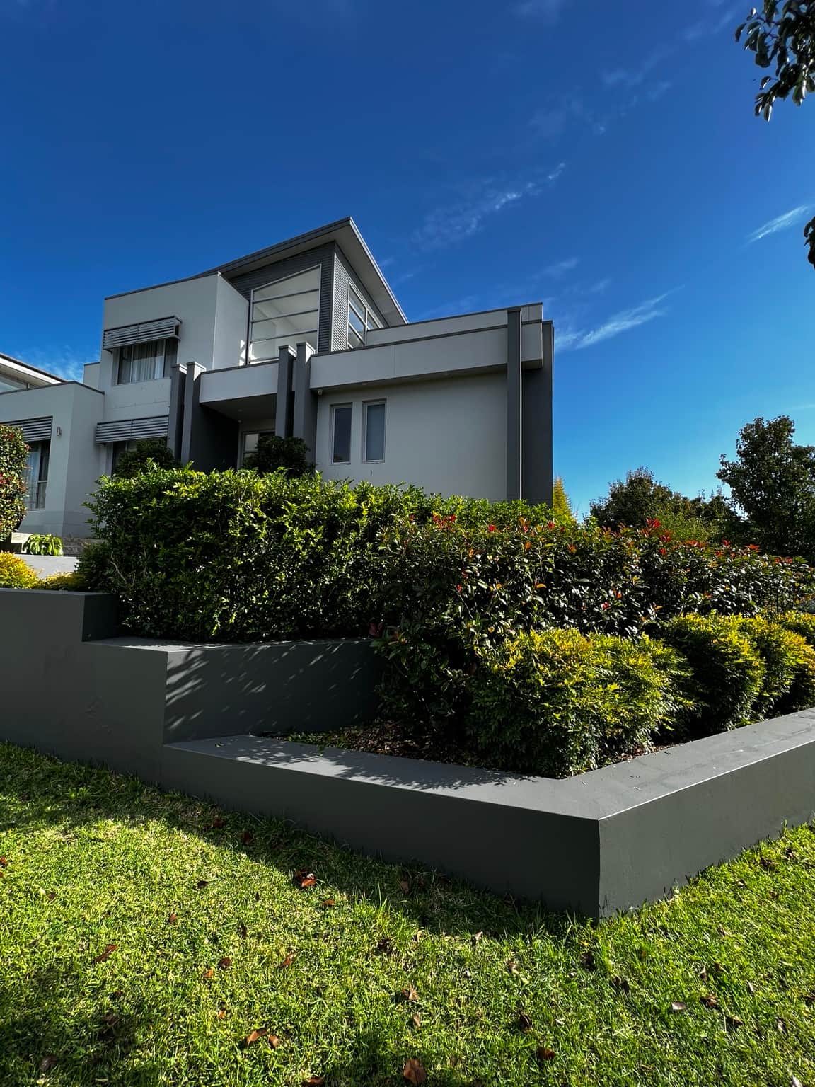 Painted exterior walls and architectural details viewed from the garden in Bella Vista