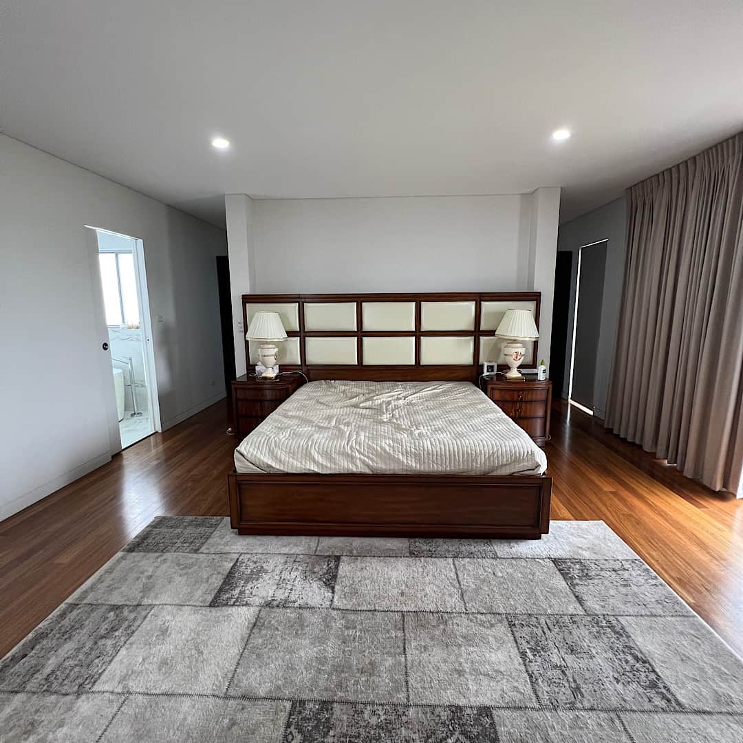 Luxury bedroom with light painted walls and ceiling in Bella Vista