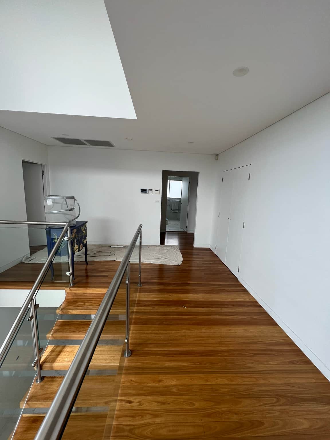 Painted upstairs hallway and doors beside the stair opening