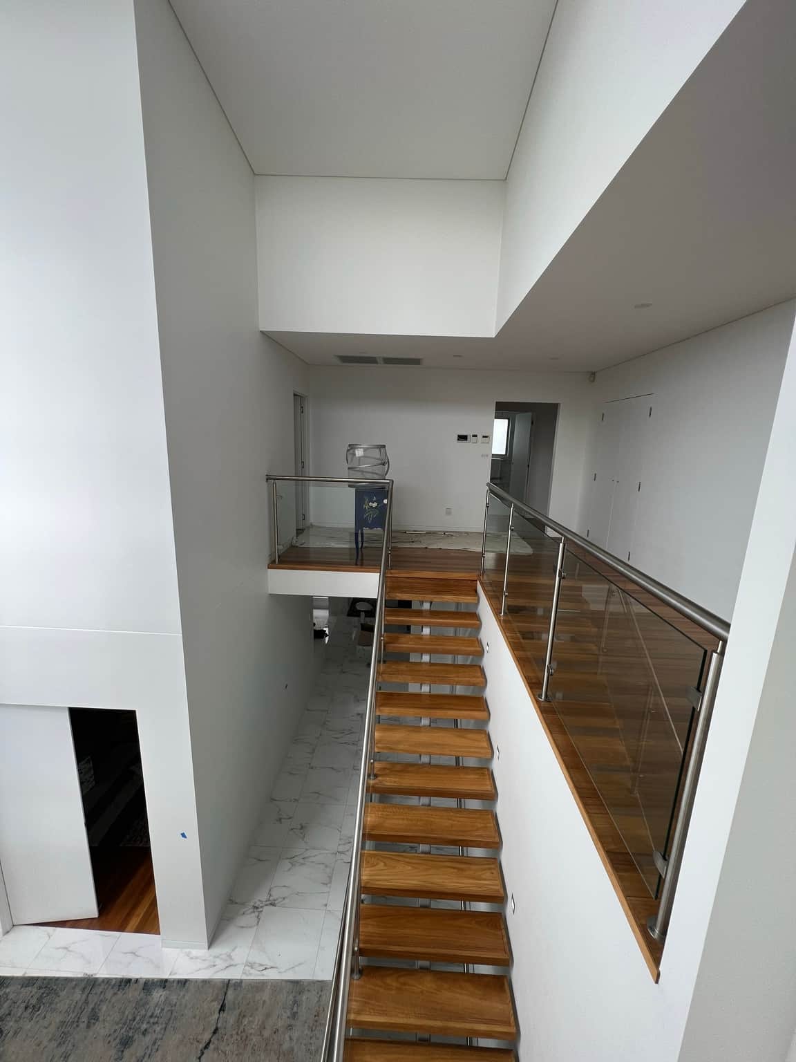 Upper stairwell walls and ceiling around the landing