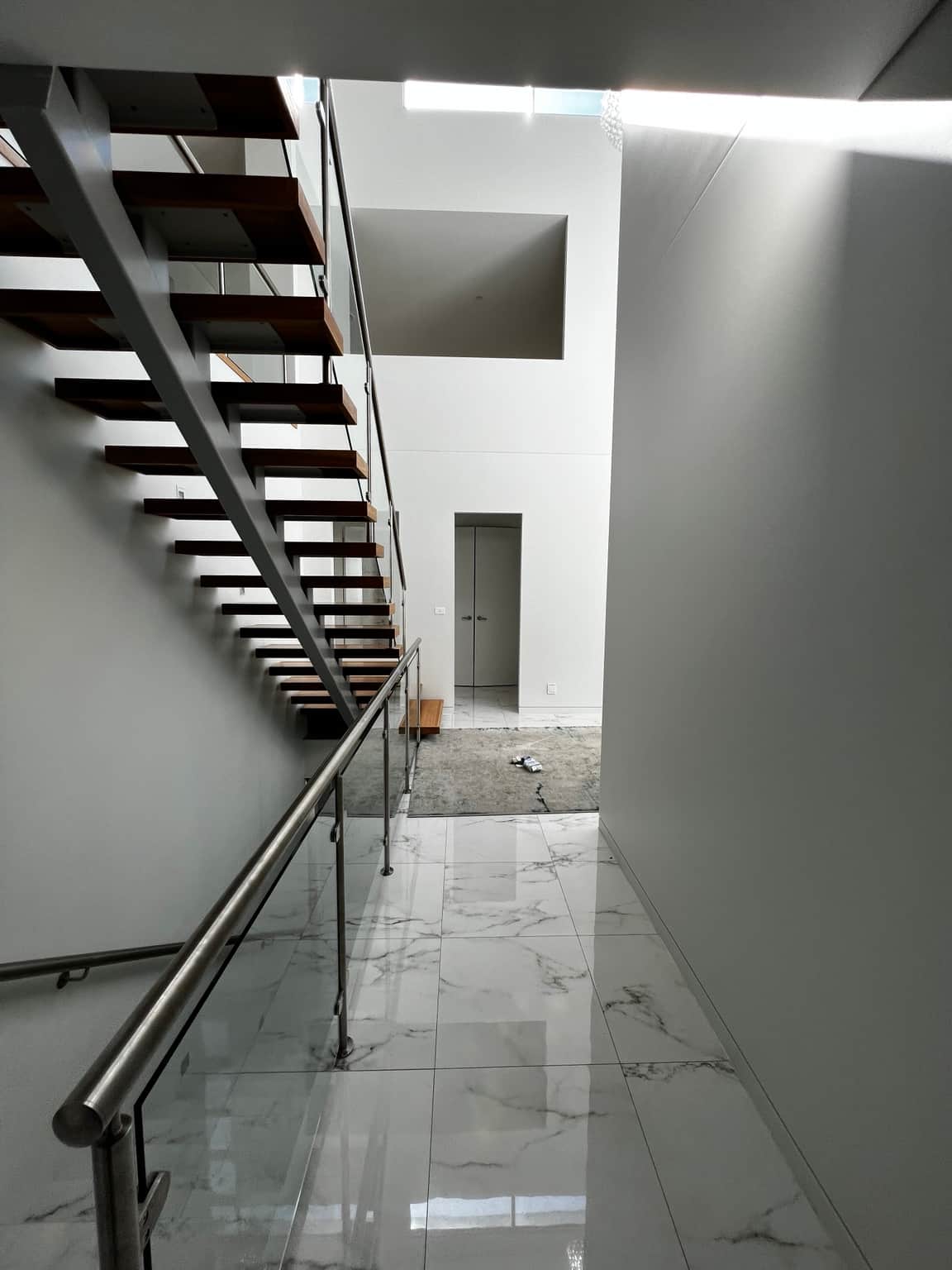 Painted corridor wall beside the open staircase