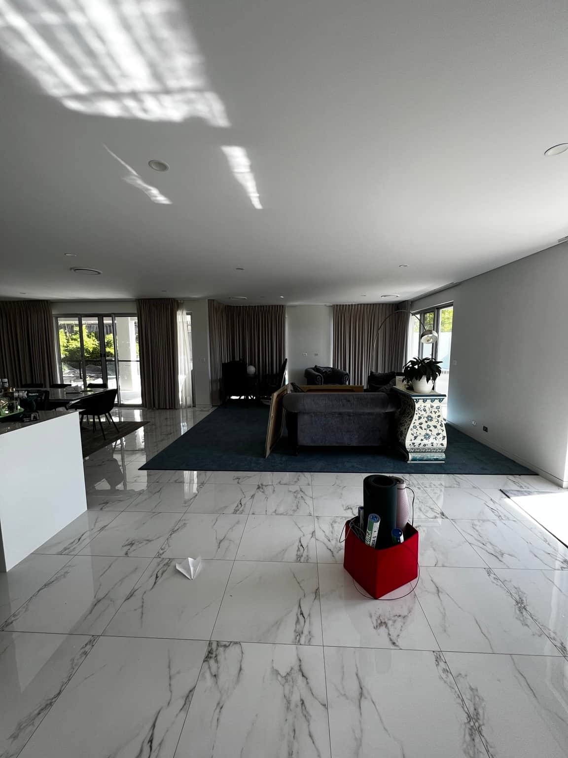 Living area ceiling and painted walls beside the kitchen island