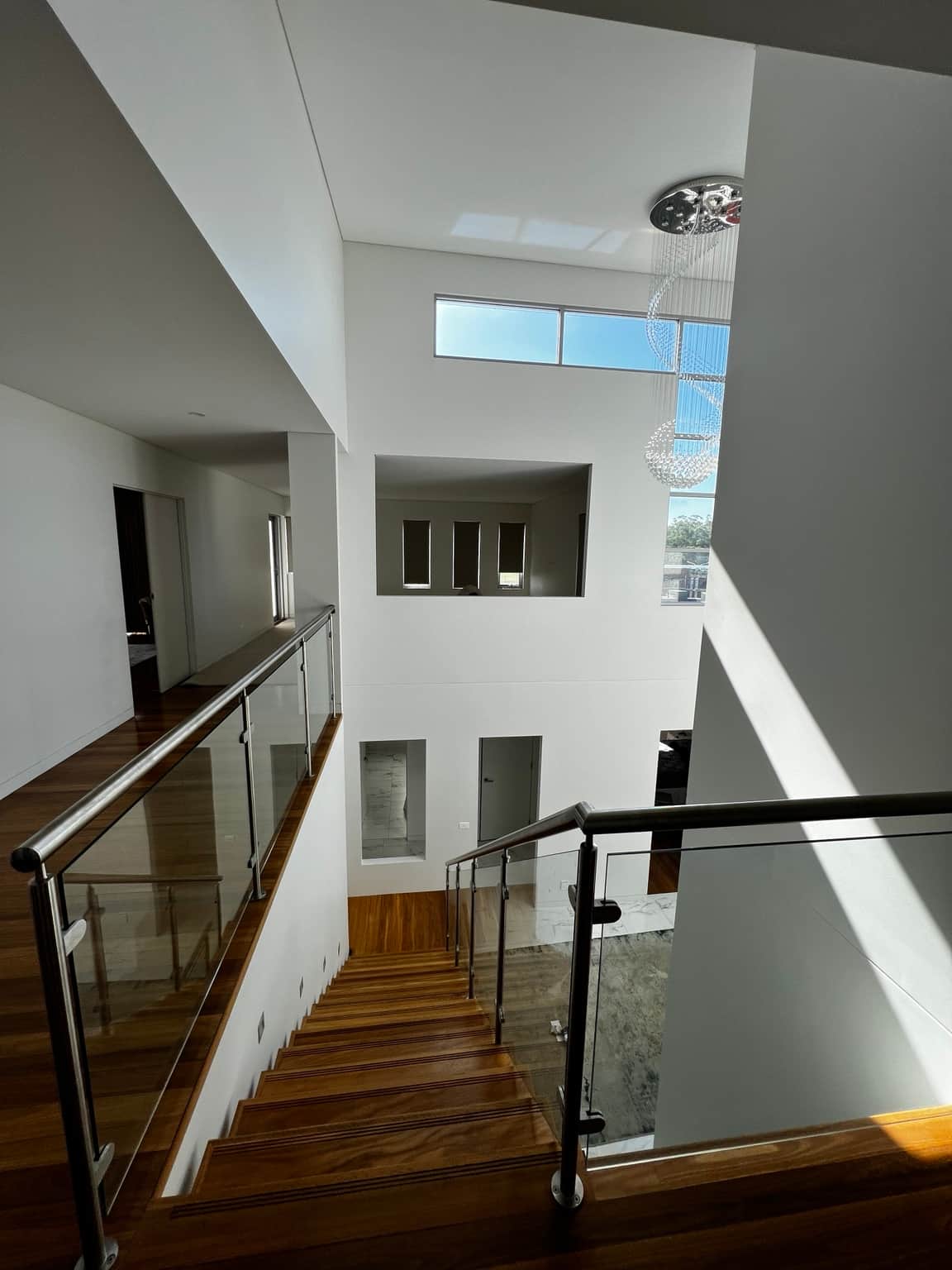 Upper hallway overlooking the painted double-height entrance