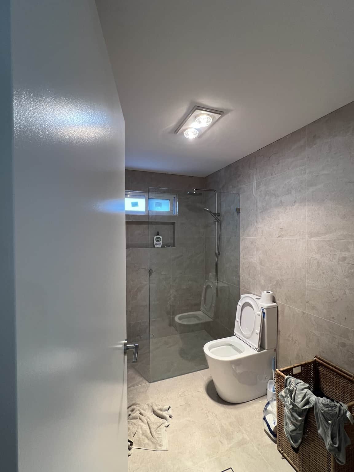 Painted bathroom door and ceiling at the Bexley interior painting project