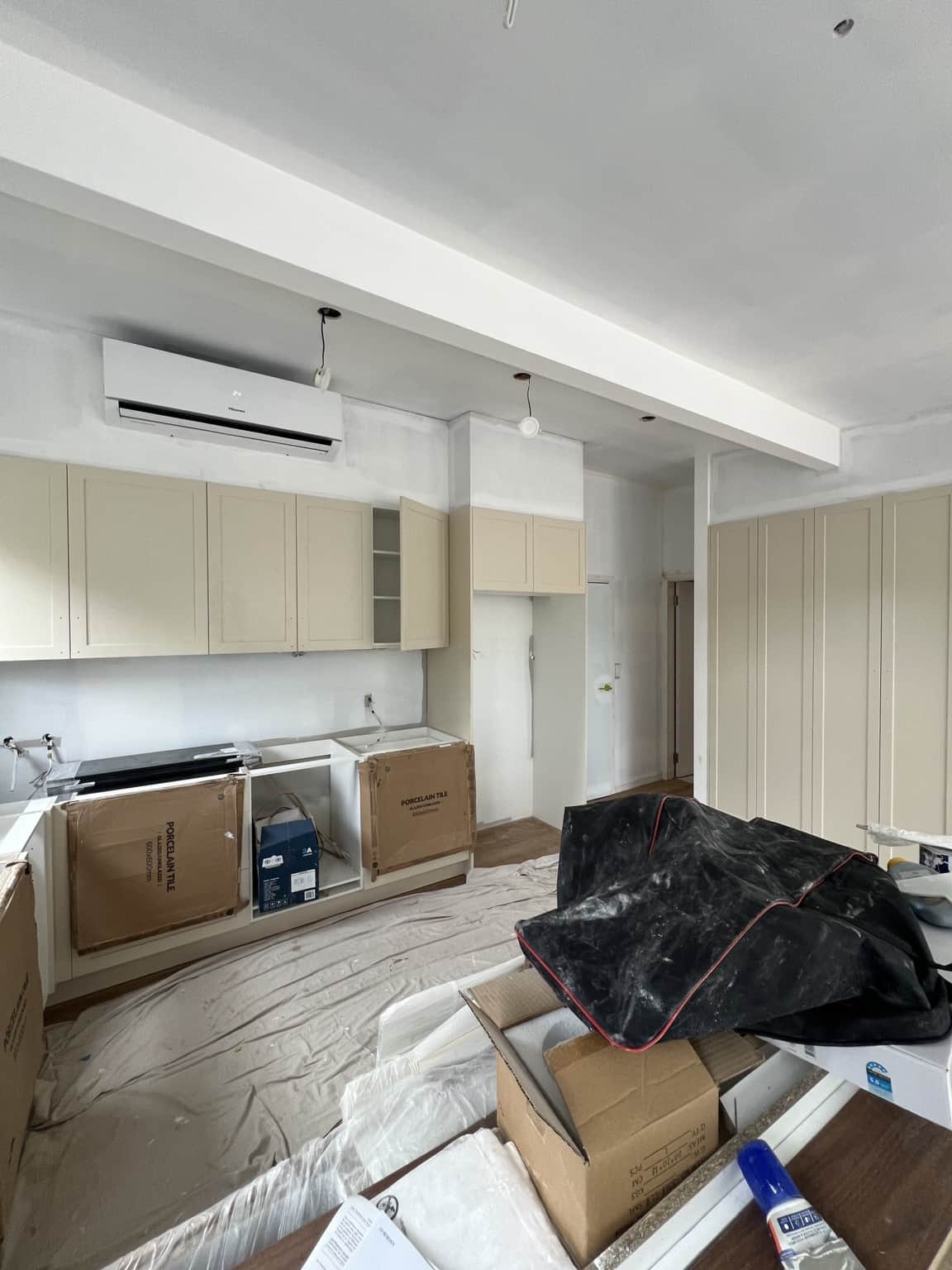 Kitchen walls and ceiling beams during preparation at the Bexley painting project