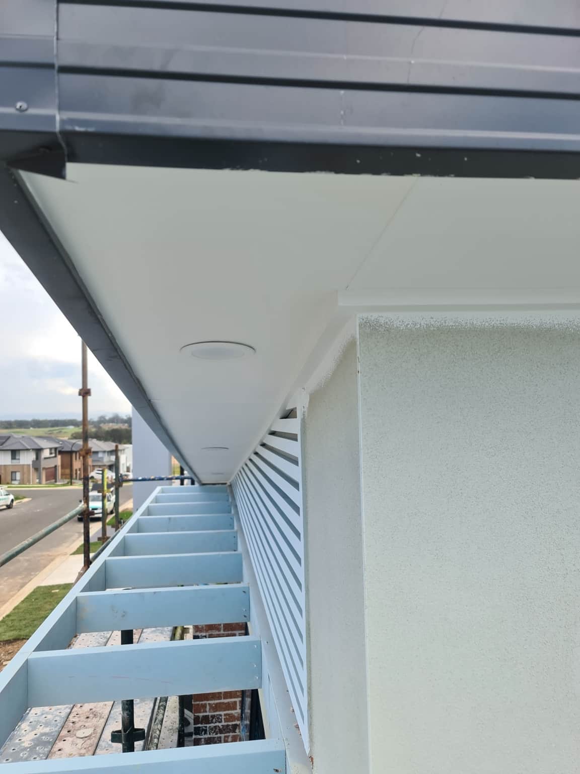 Close view of the painted soffit and textured exterior wall in Box Hill