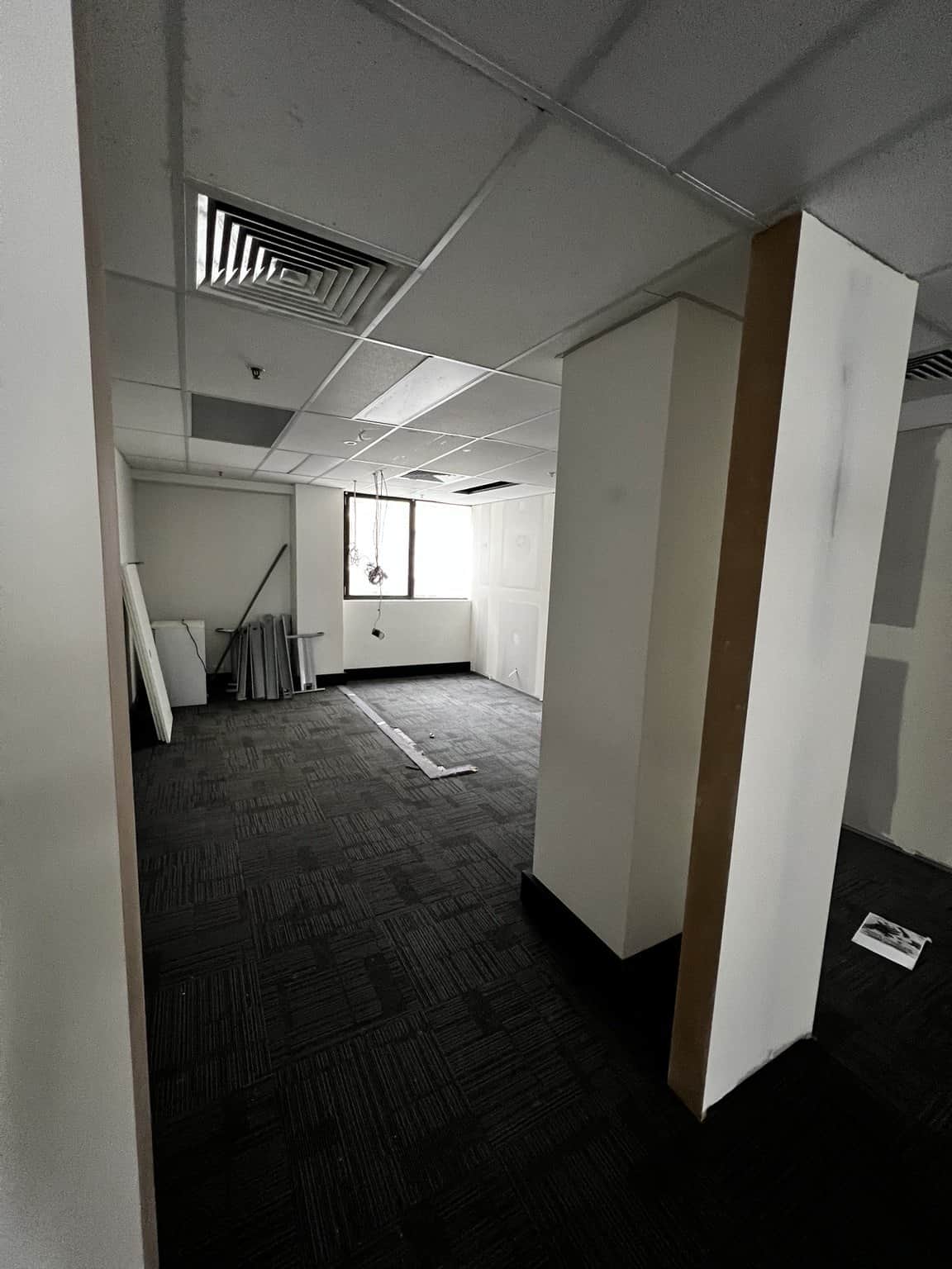 Prepared column and office partition beside a windowed room in Chatswood.