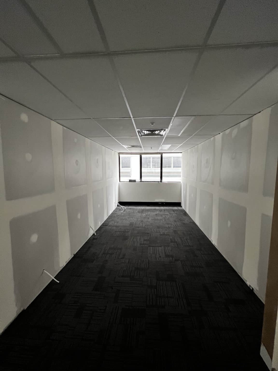 Chatswood office partition walls showing taped and filled joints before the finishing stage.