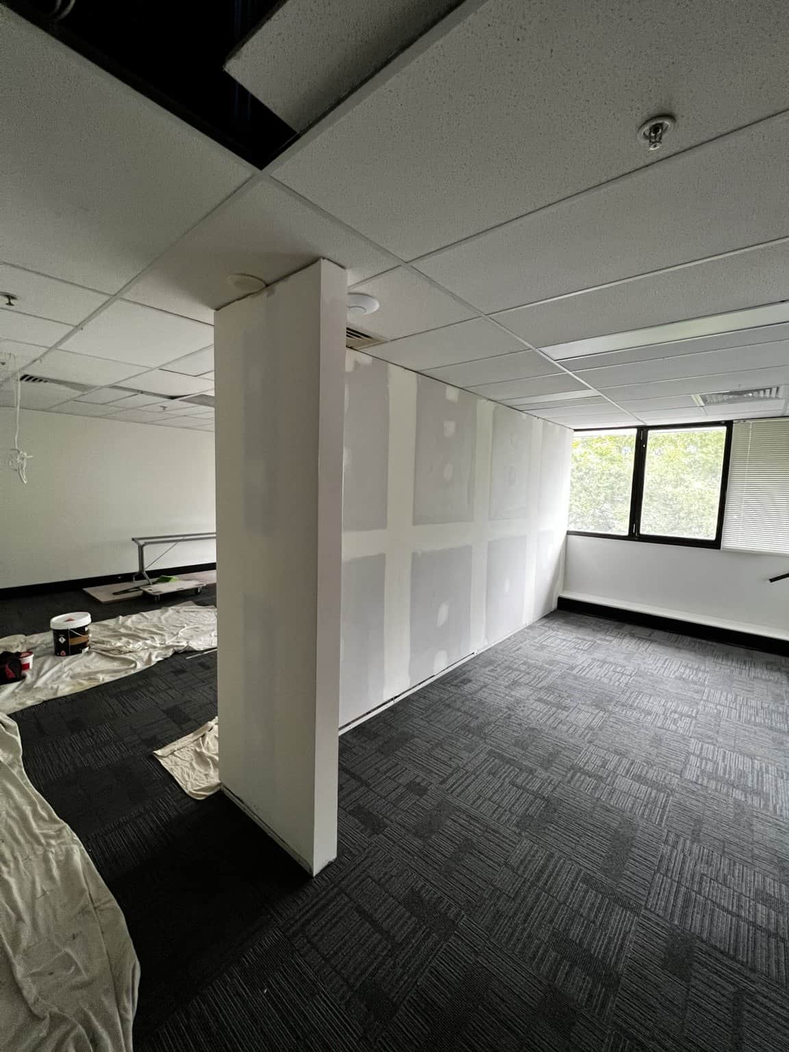 Office partition walls with visible plaster joints during preparation in Chatswood.