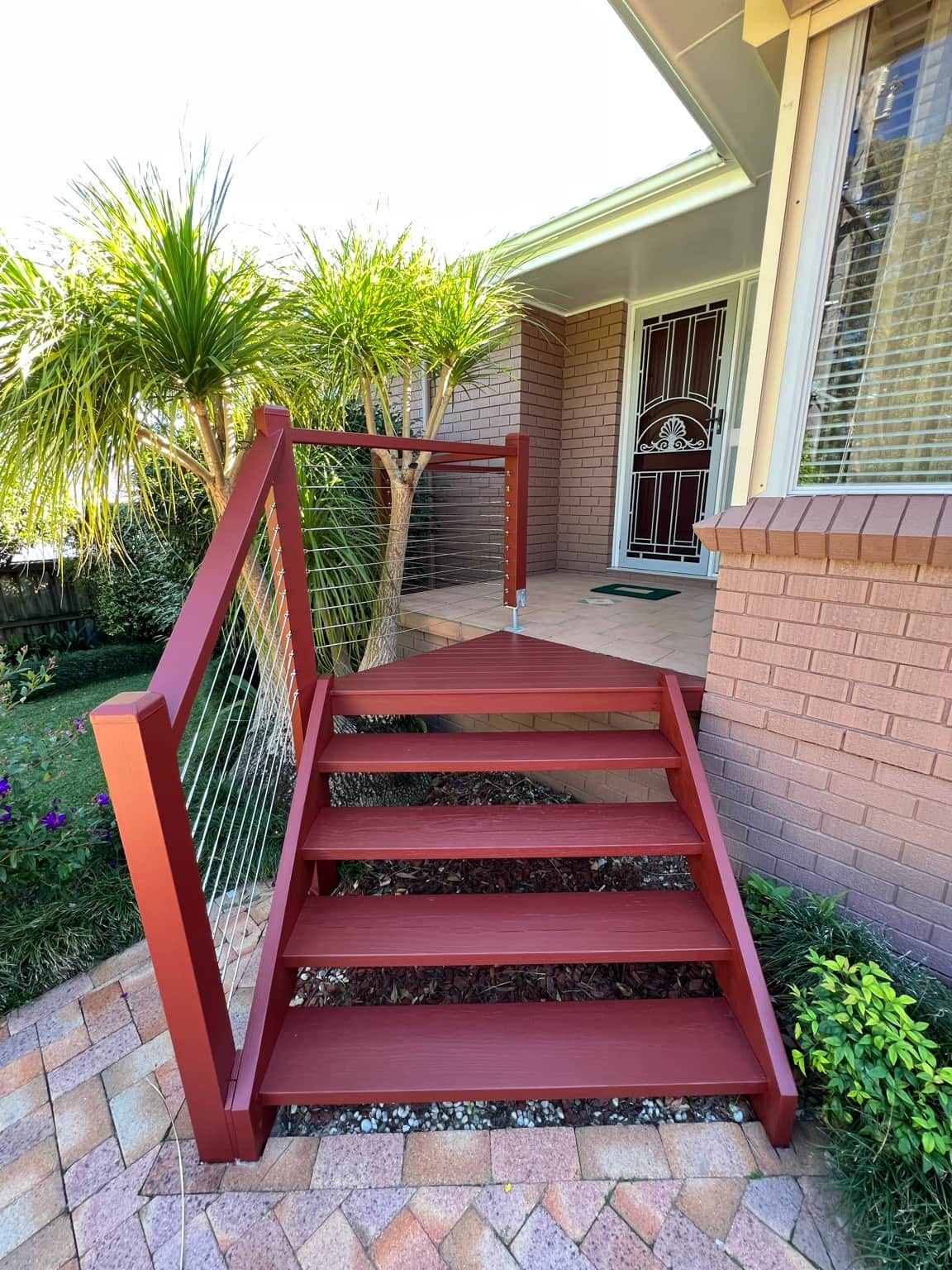 Front entry steps and painted brickwork at the Cowan home