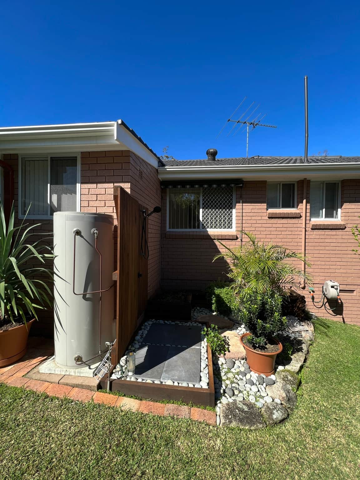 Rear exterior brickwork after painting at the Cowan property