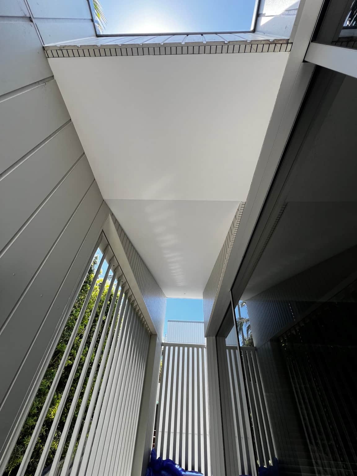 Painted ceiling along the covered exterior walkway at the Dover Heights property