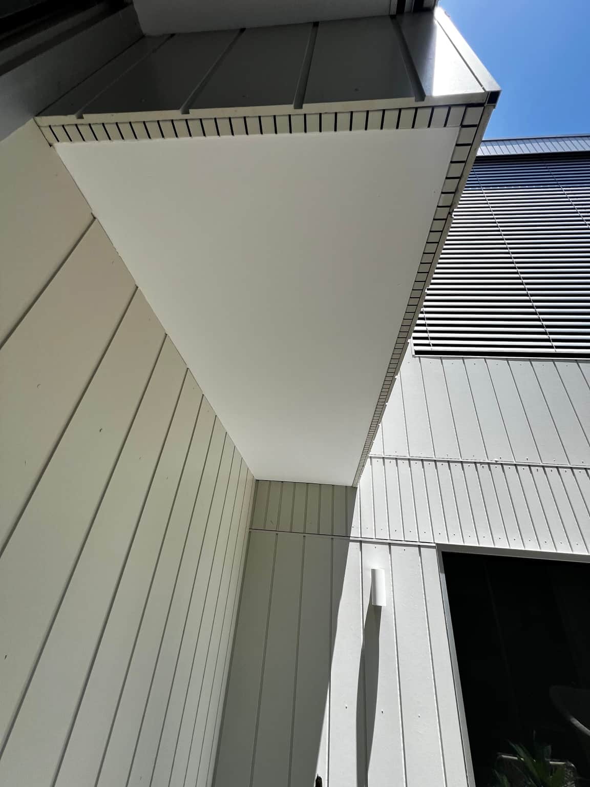 Close view of the eaves and vertical exterior cladding in Dover Heights