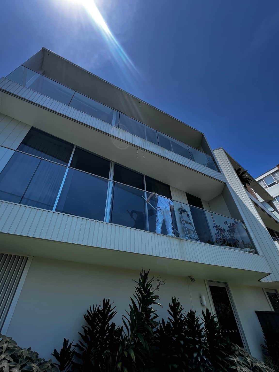 Dover Heights exterior house painting project using Dulux Weathershield, viewed towards the upper balcony