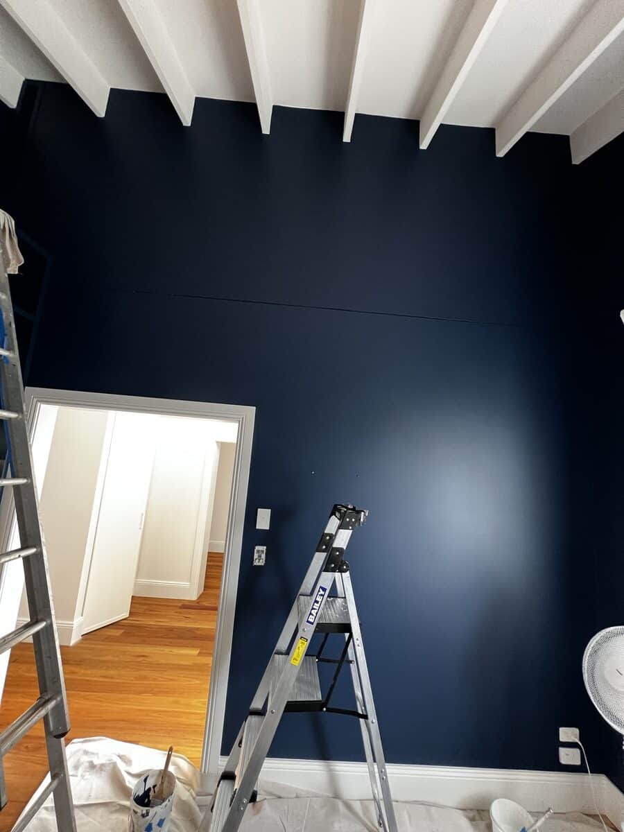 Interior feature wall painting in progress at Dover Heights residential project