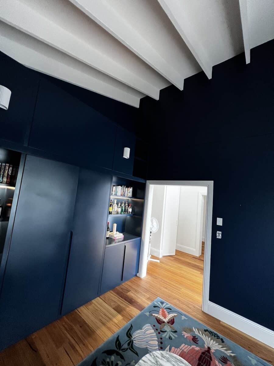 Dover Heights feature wall and built-in cabinetry with dark blue painted finish