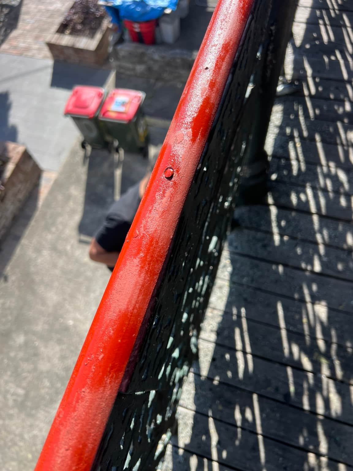 Granville balcony handrail during Rust Guard treatment after sanding
