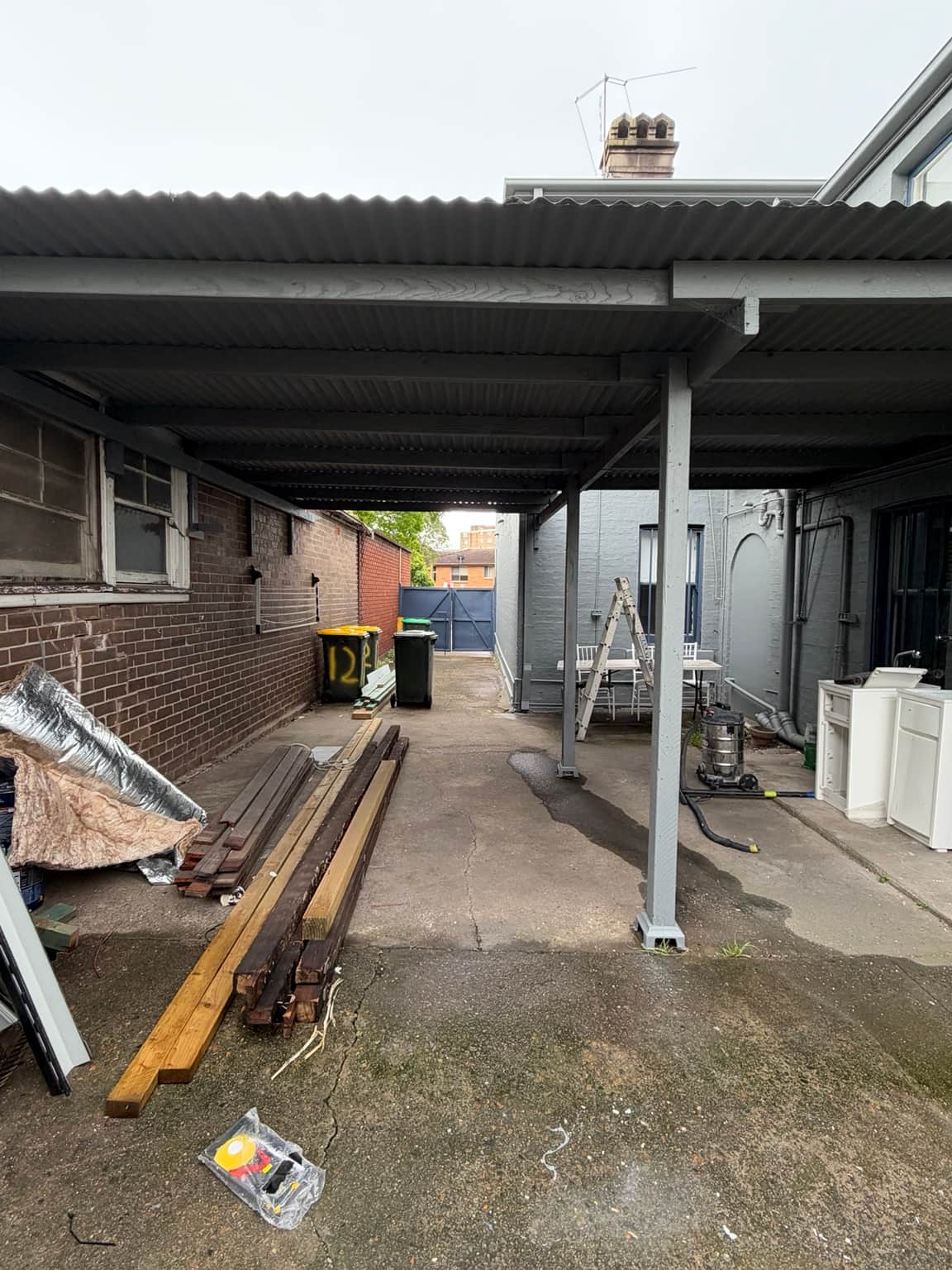 Covered rear walkway and painted posts after the Granville exterior repaint
