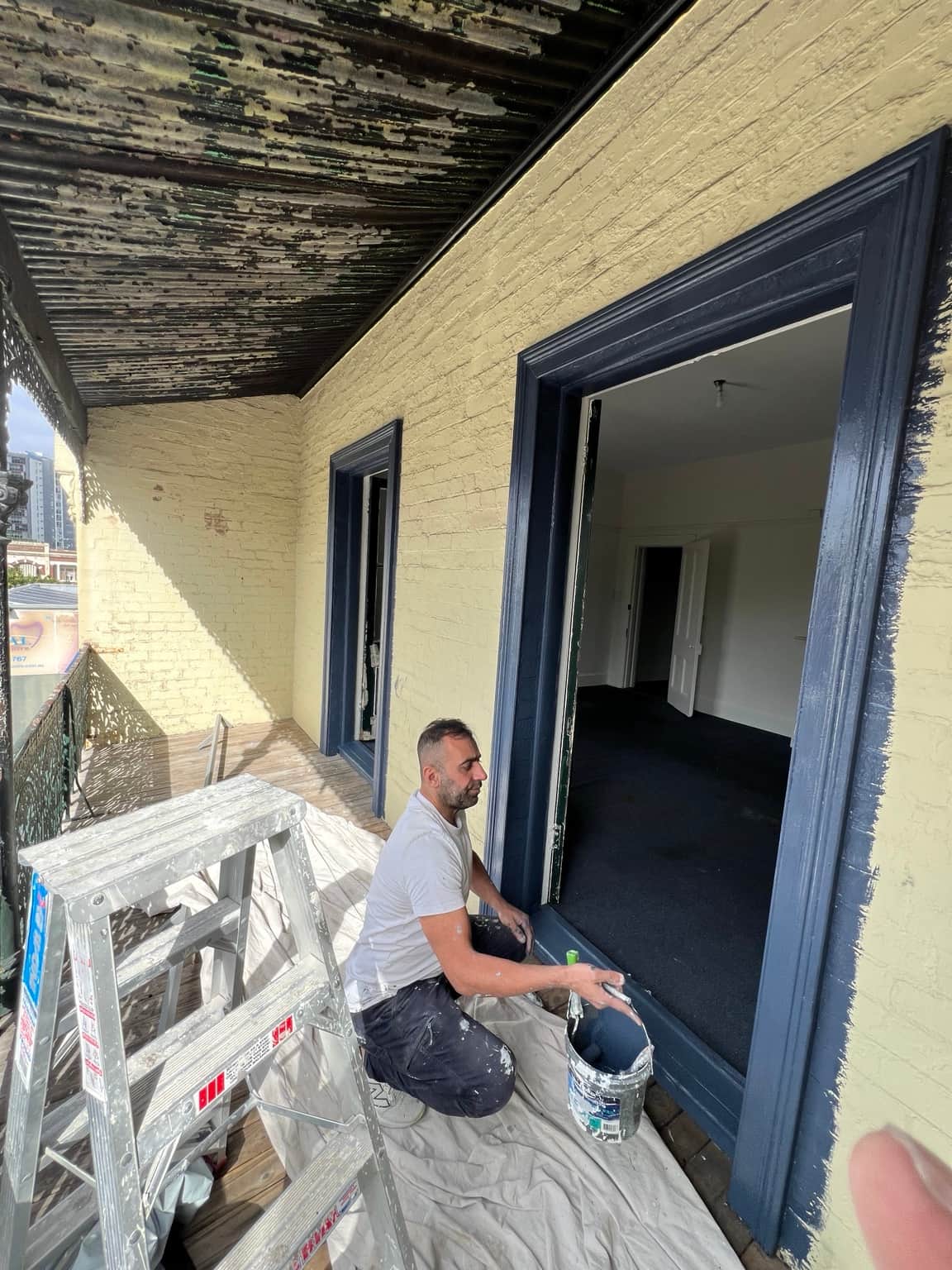 Peeling paint on the verandah ceiling before preparation at the Granville property