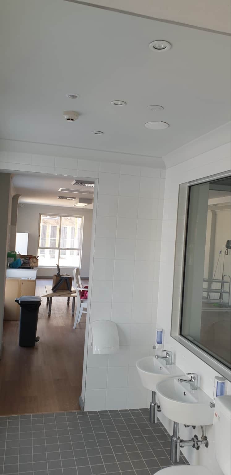 Painted bathroom ceiling and cornices at the Hornsby childcare centre