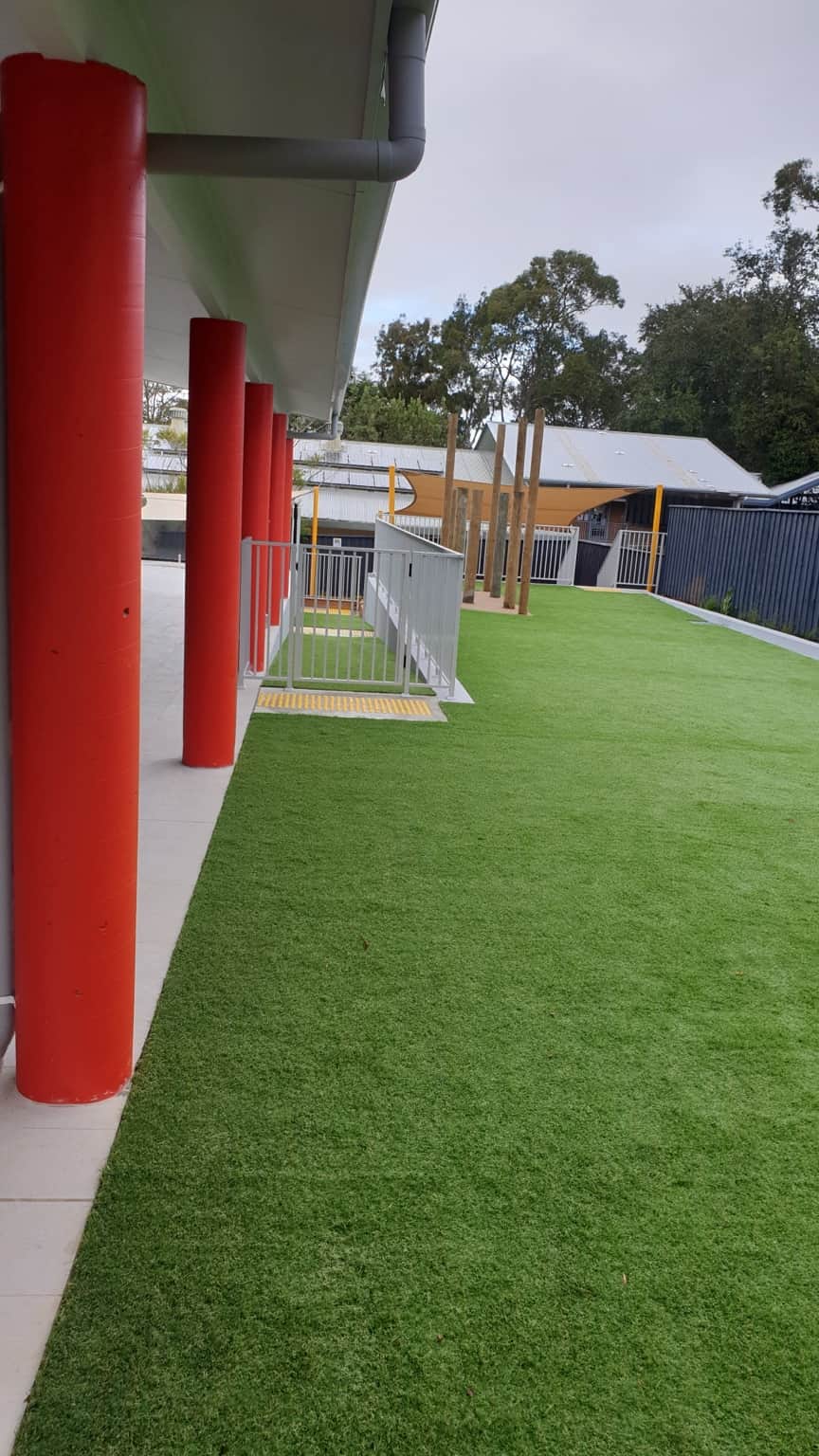 Finished covered walkway with painted ceiling and red columns in Hornsby