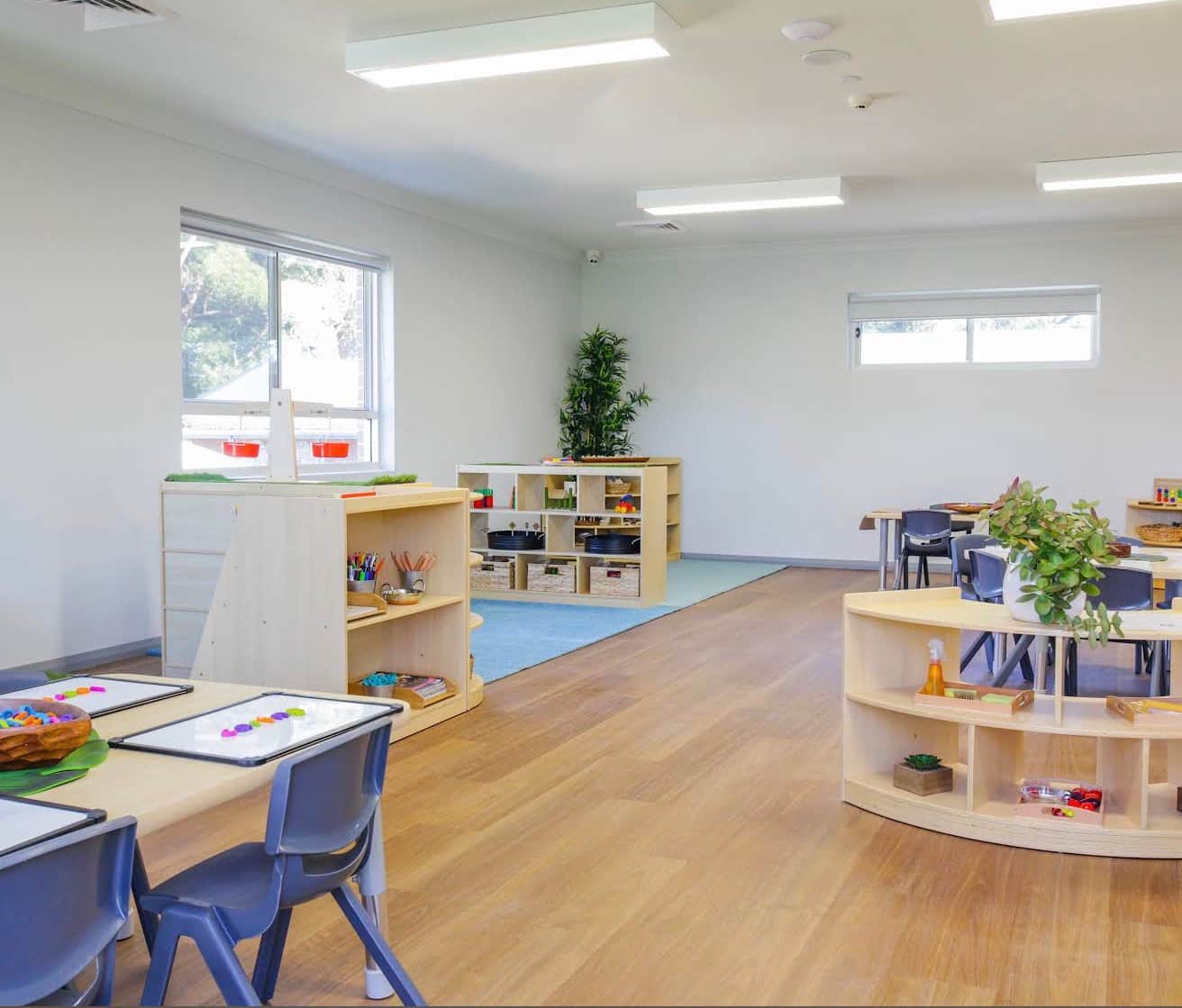 Finished learning room with white painted walls and ceiling at Belonging Early Learning, Hornsby