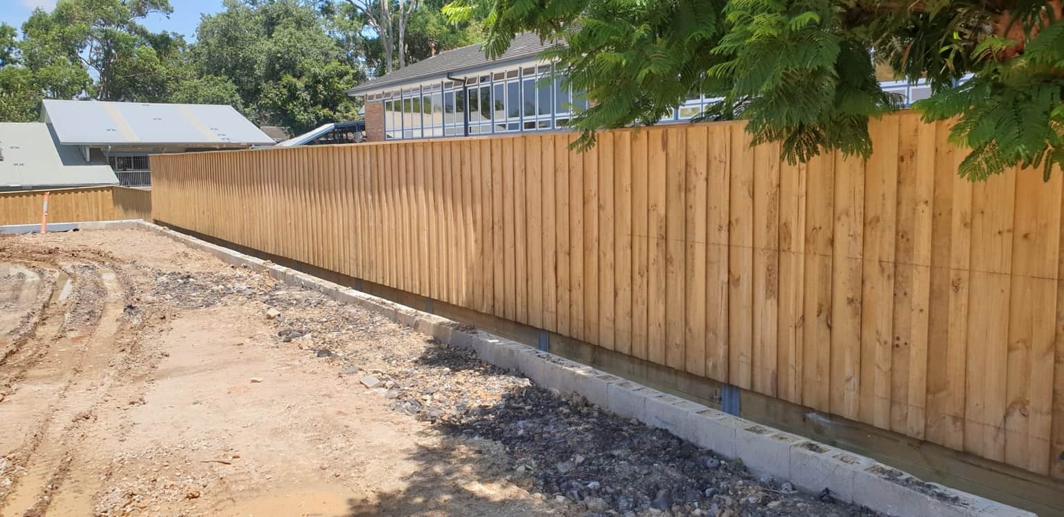 Unpainted timber boundary fencing before coating at the Hornsby childcare centre