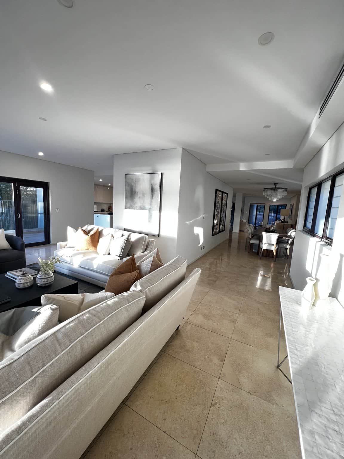 View from the lounge towards the hallway, showing light walls and ceiling in a Northbridge home.
