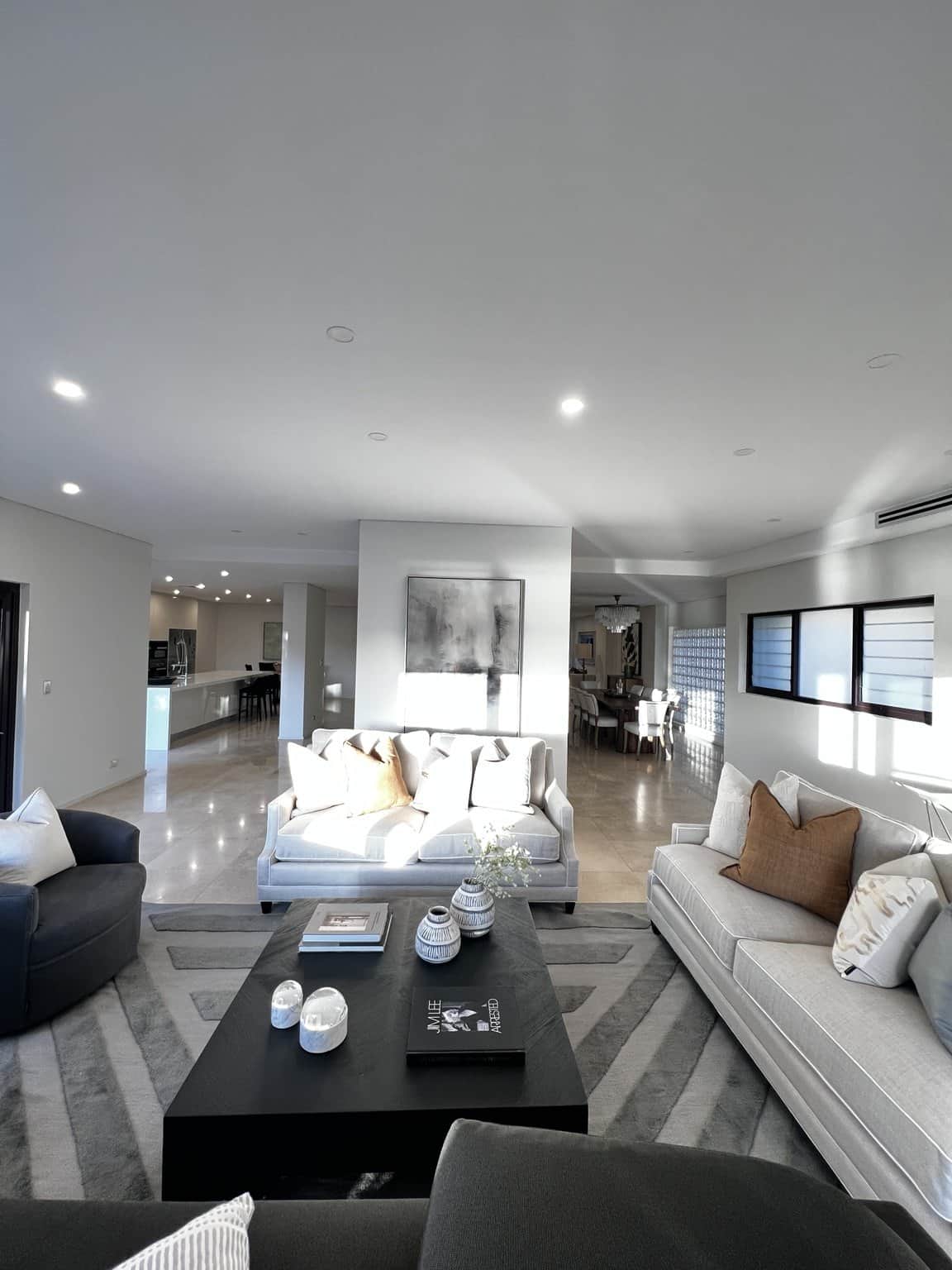 Light painted walls and ceiling above a furnished lounge in Northbridge.