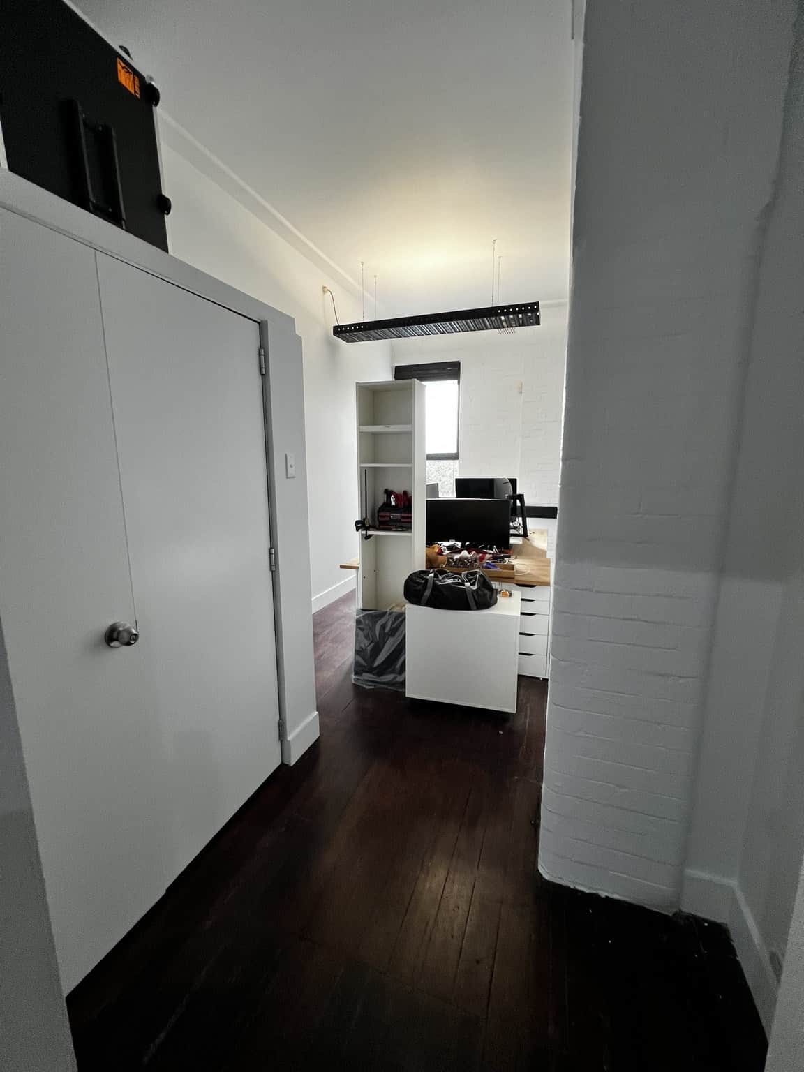 Office furniture and floors protected during commercial painting preparation in Chippendale