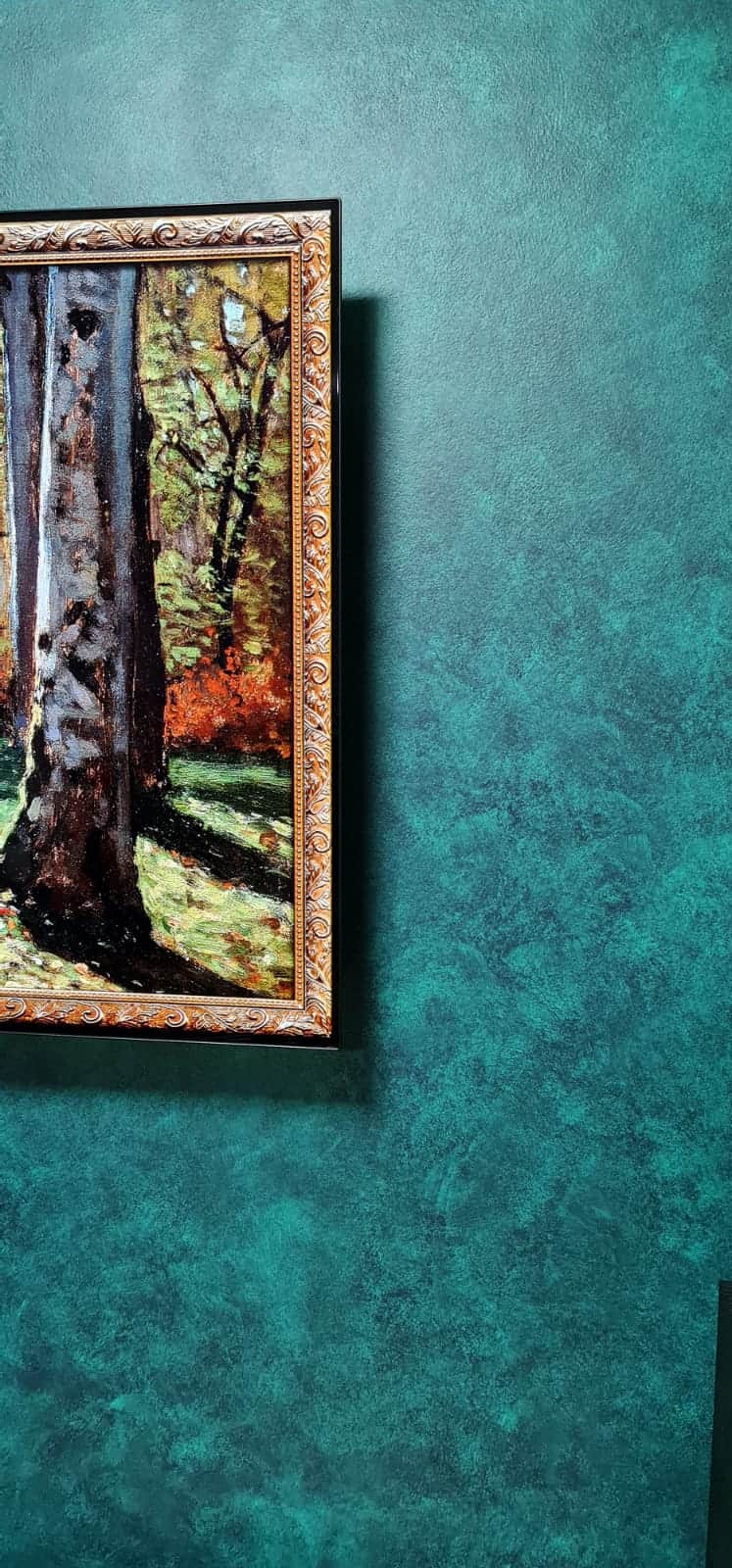 Teal French Wash wall detail showing layered colour beside a gold-framed painting