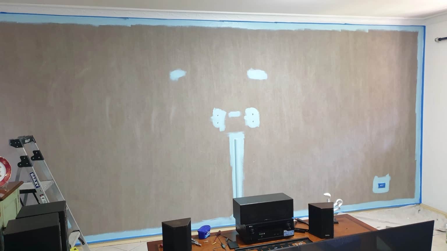 Patched and masked living-room wall during preparation for French Wash in Merrylands