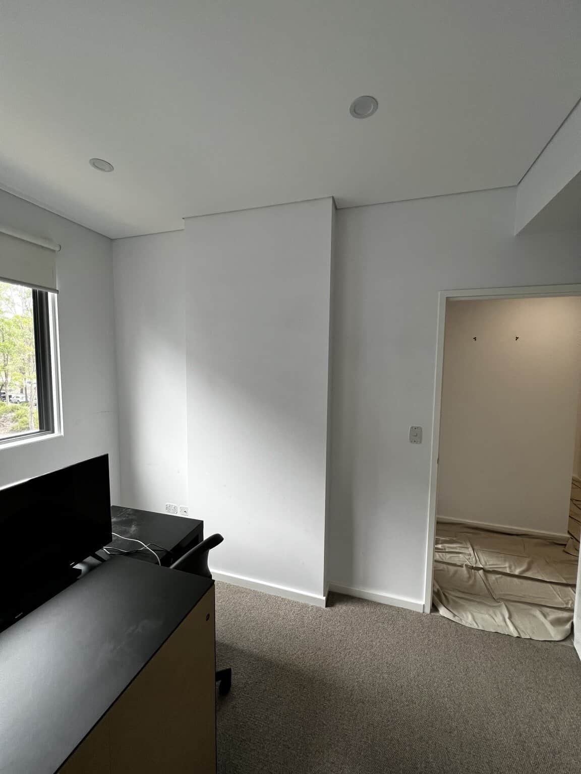Bedroom wall preparation before interior apartment painting in Rouse Hill