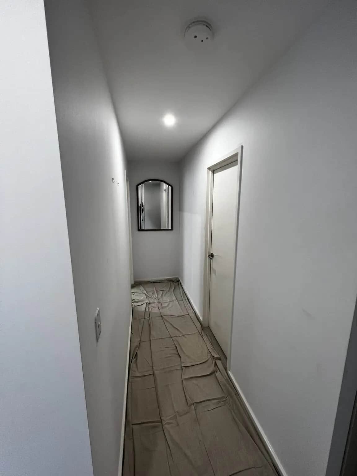 Hallway walls protected and prepared before interior painting in Rouse Hill