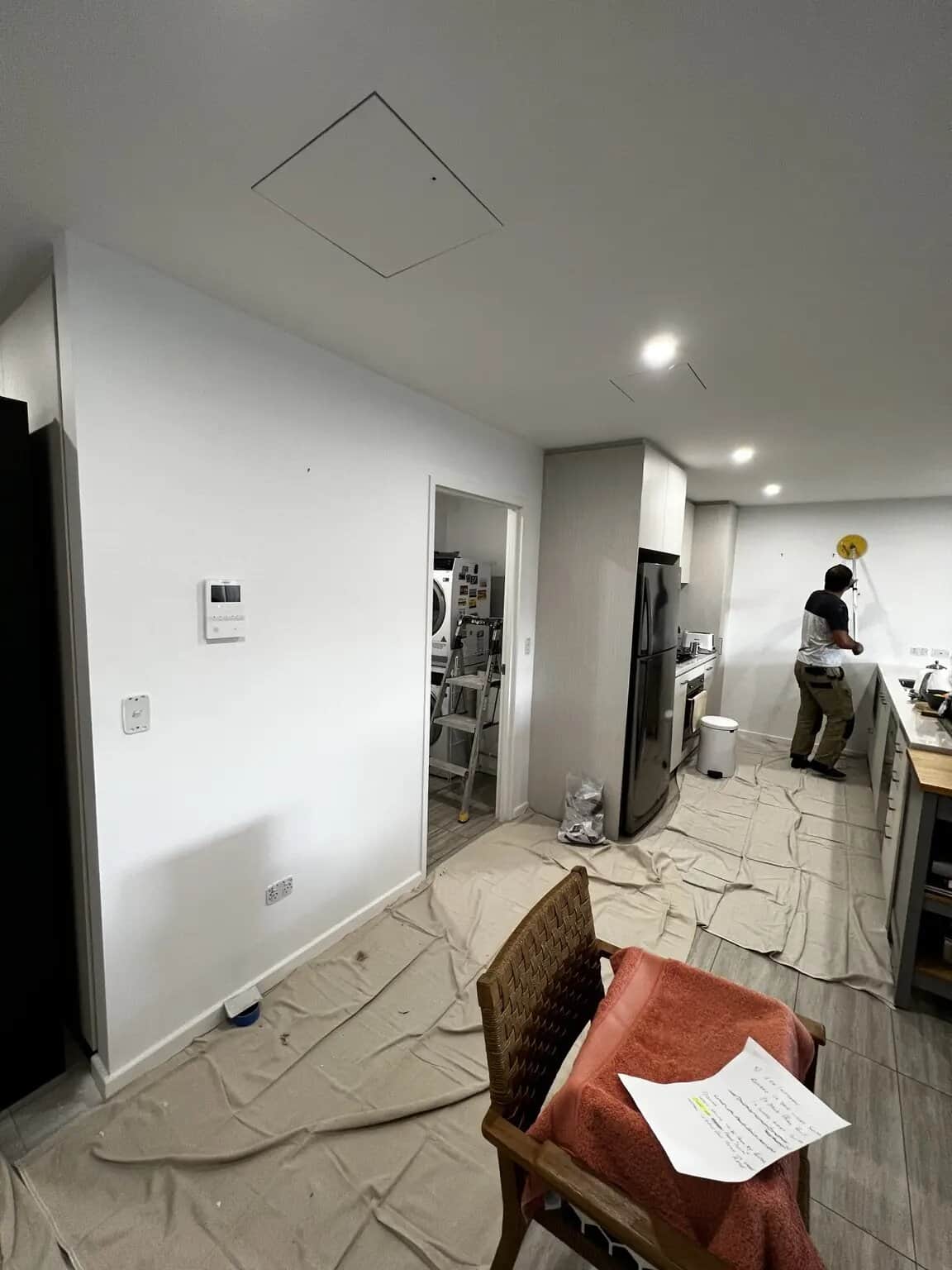 Kitchen and dining walls protected before professional painting in Rouse Hill