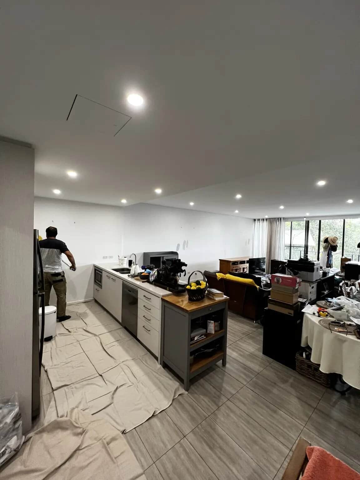 Open-plan kitchen and living room before repainting by Sky Painting & Decorating