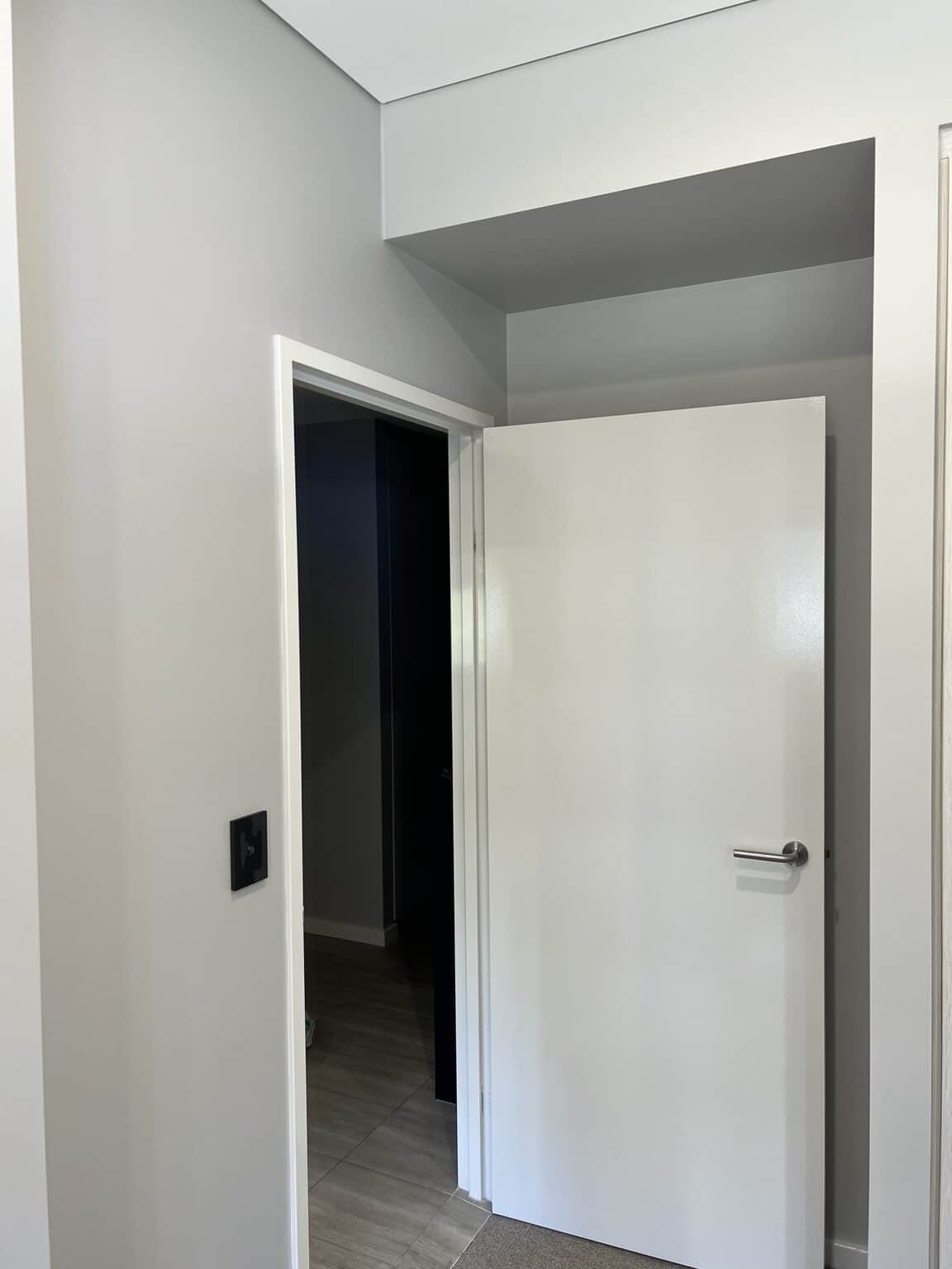 Freshly painted internal door and hallway walls in a Rouse Hill apartment