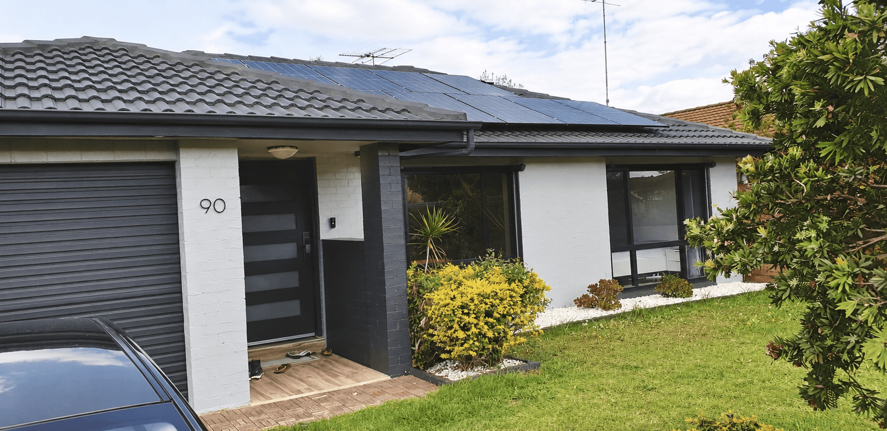 Front facade and coated tiled roof after exterior house painting in St Clair