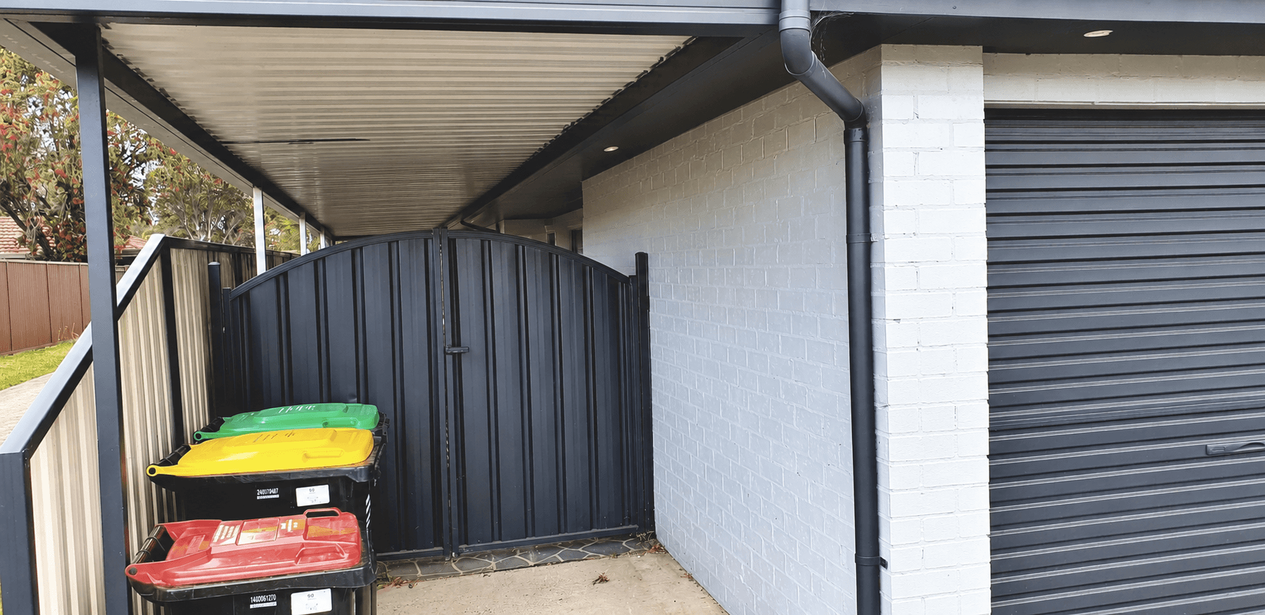 Painted brickwork, side gate and garage area during the St Clair exterior project