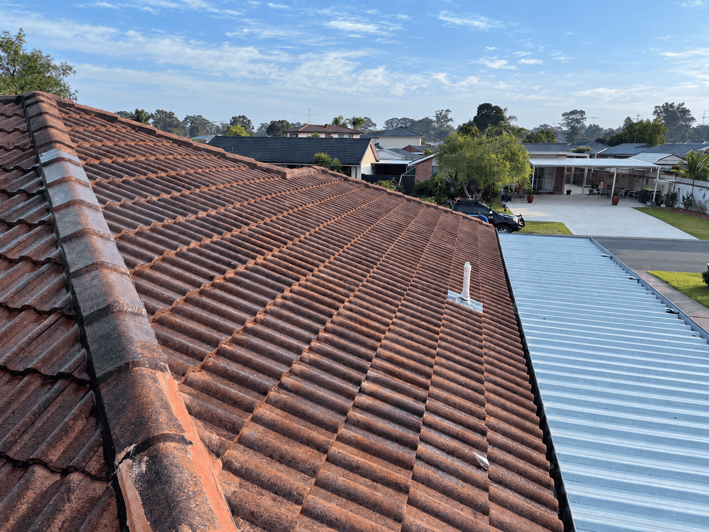 Original weathered roof tiles before coating at the St Clair house