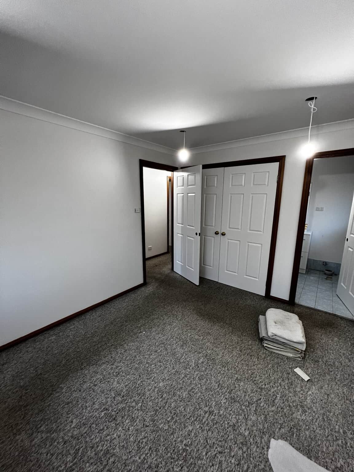 Repainted St Marys bedroom with Natural White walls and Natural White Quarter wardrobe doors.
