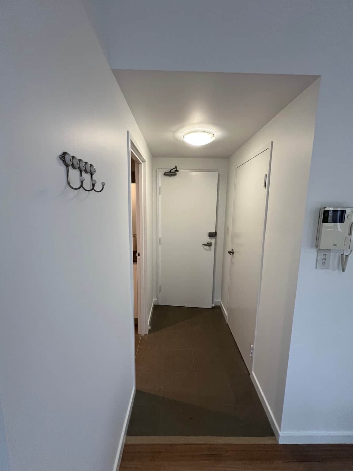 Wahroonga apartment entry with freshly painted white doors, jambs and hallway walls