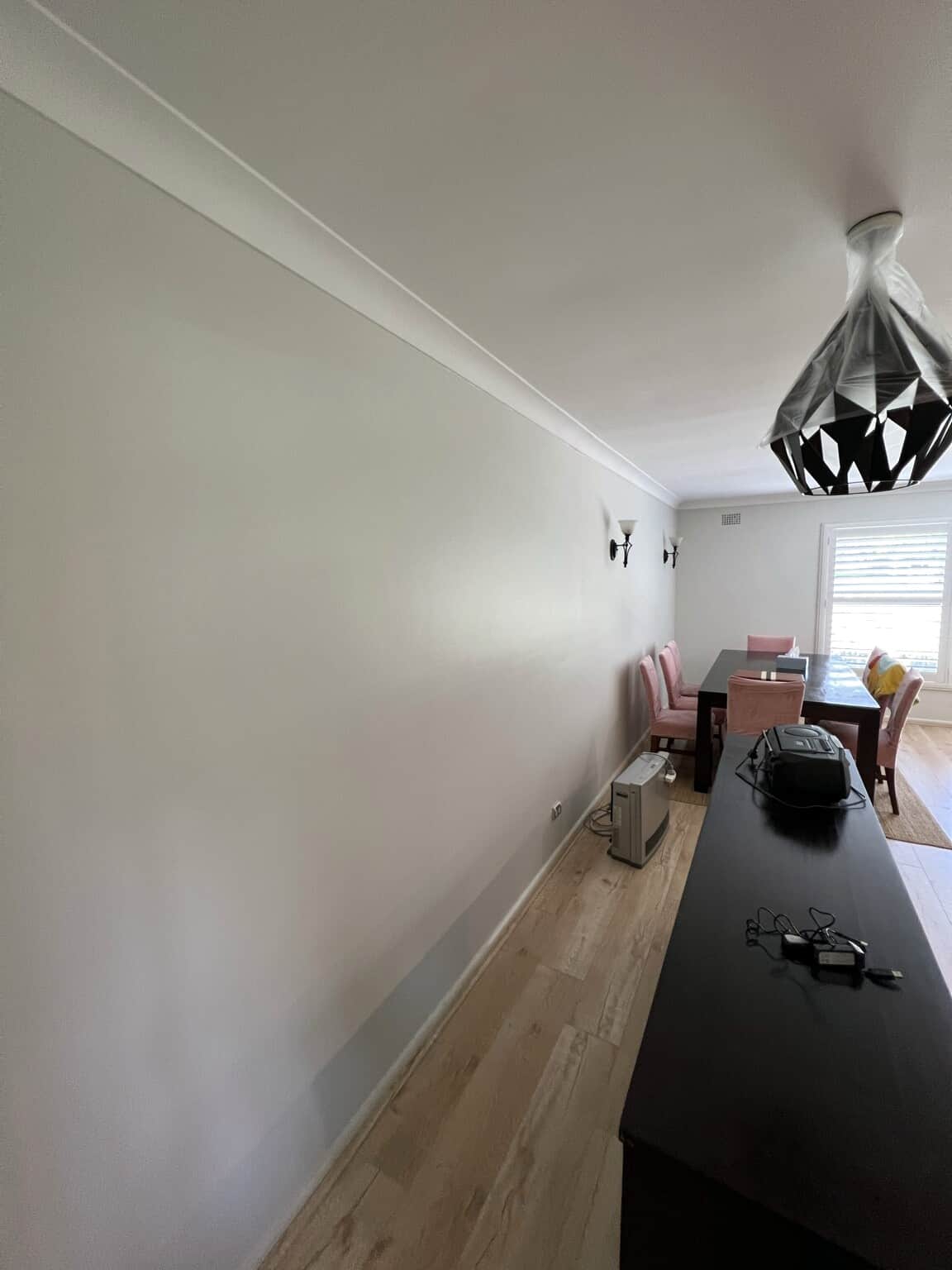 Fresh neutral wall and ceiling finish in a Winston Hills dining area after professional interior painting.
