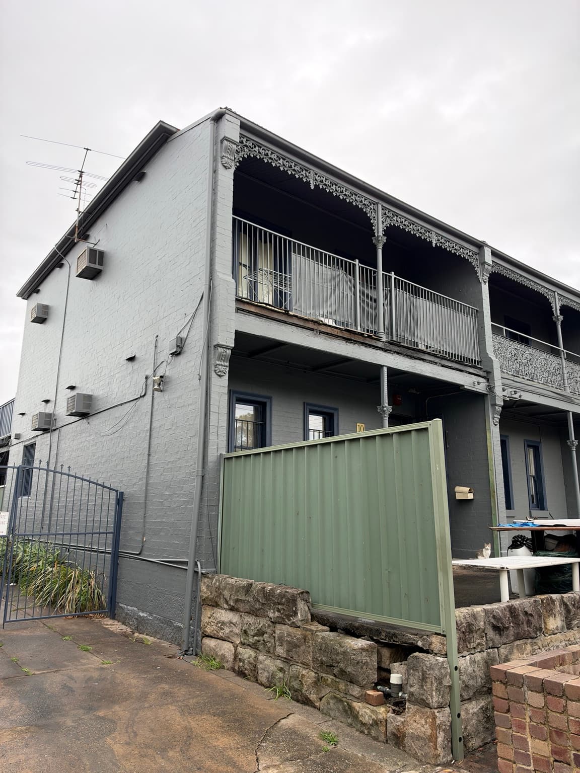Granville property after exterior repainting in grey with Berger Solarscreen, viewed from the front corner, after