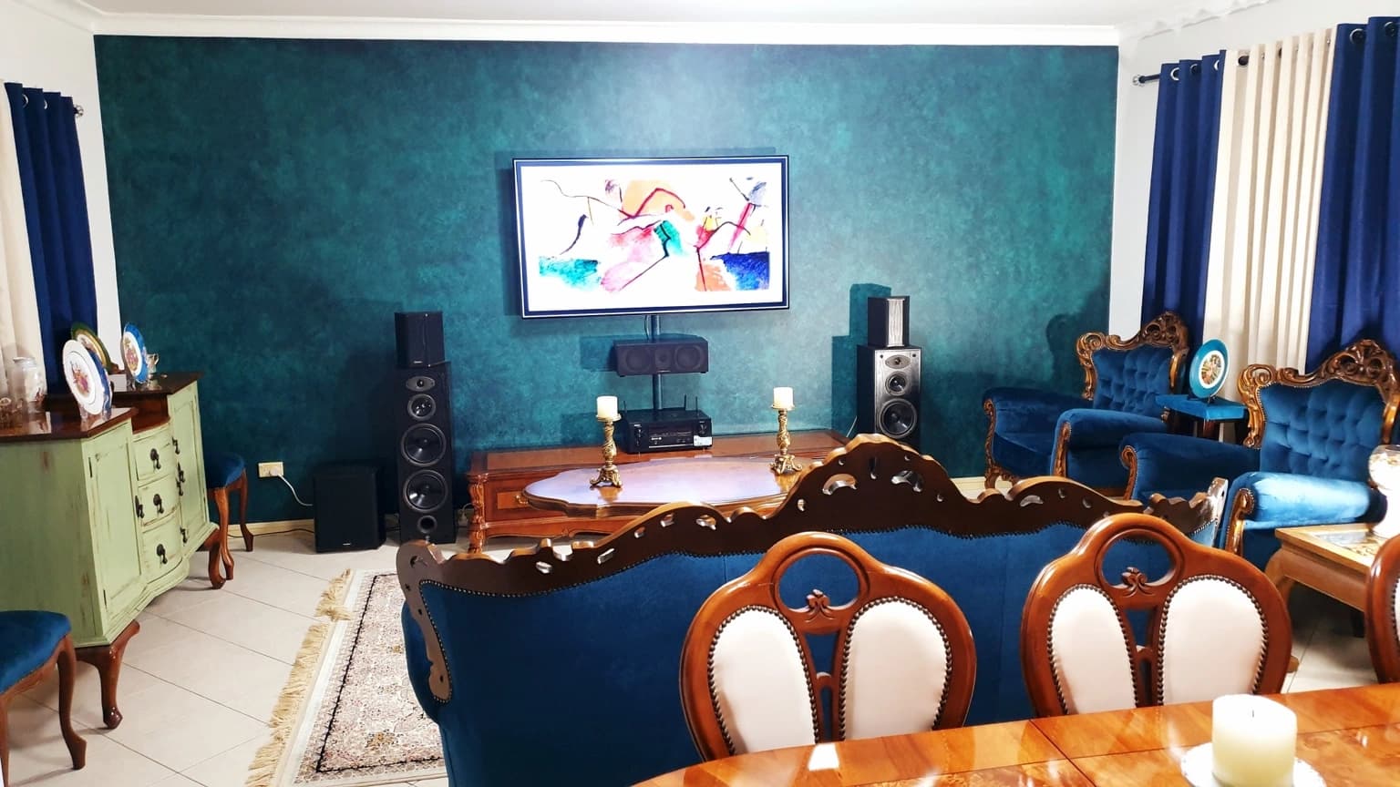 Completed teal and green Porter’s French Wash feature wall behind the television in a Merrylands living room, after