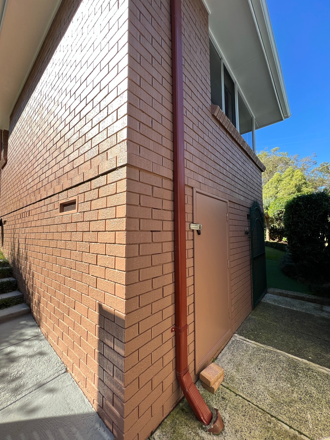 Painted side elevation and aluminium window frames in Cowan, after